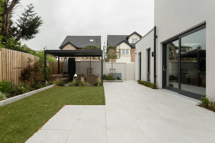 a house with a large yard and a covered patio