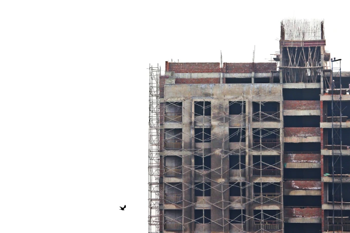 a tall building with scaffolding on the side of it
